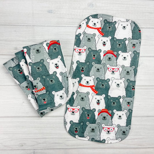 Flannel burp clths with Smiling & Laughing bears in shades of gray. the bears are wearing hats, scarves and glasses in red and orange. 